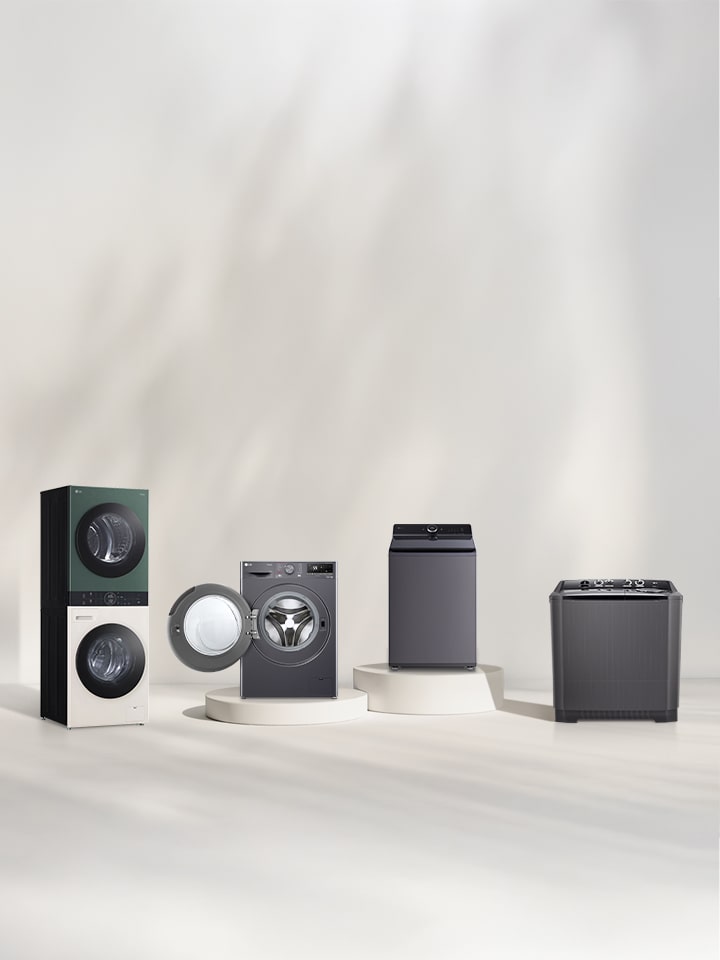 In front of the beige wall, there is the LG Wash Tower front loading washer, top loading washer, and twin washing machine lineup. On the right, you can see the forest view.