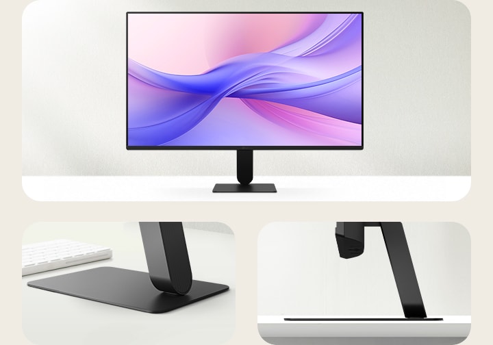 A front view of a modern monitor with a slim, minimalist stand. The monitor, initially angled to the left, smoothly rotates to face forward and locks into place. As it settles, a streak of white light quickly traces along the monitor’s edges, emphasising its sleek bezel design. The display shows a soft gradient of pink and purple tones, while side images highlight the stand’s low-profile base and elegant form.