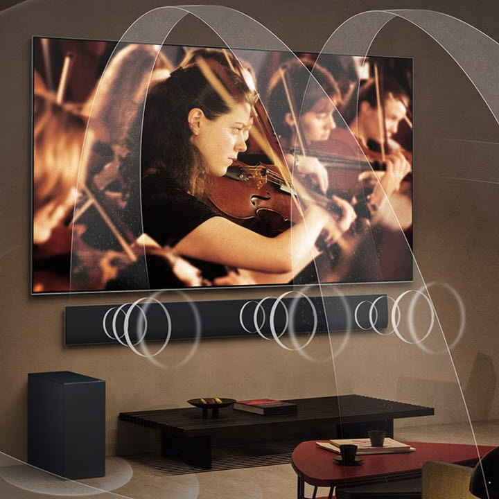 telewizor wiszcy na ścianie LG OLED serii G w salonie z efektem dżwiękowym surround wzmocniony przez soundbar LG SG10