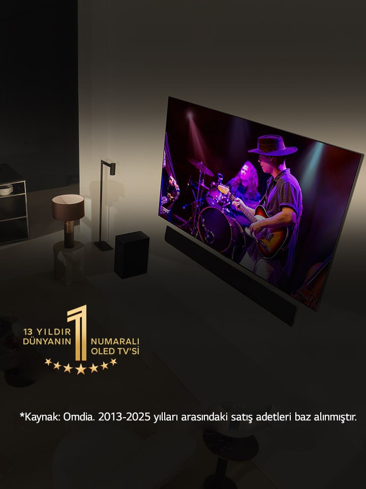 Modern bir dairede geniş ekran OLED TV’de konser seyreden bir adam ile kadının tepeden görünümü. Görüntüde “11 Yıldır Dünyanın 1 Numaralı OLED TV’si” amblemi yer alıyor. Bir sorumluluk reddi ekranda görünür: “Kaynak: Omdia. Birim sevkiyatları, 2013 - 2023. Sonuçlar, LG Electronics tarafından onaylandığı anlamına gelmemektedir. Sonuçlara güvenilmesi üçüncü tarafın kendi sorumluluğundadır. Daha fazla detay için https://www.omdia.com/ adresini ziyaret edin.”