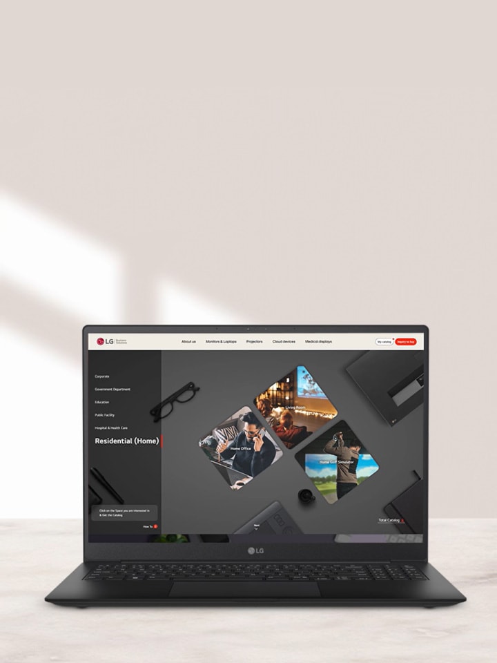 LG laptop displaying the IT Digital Showroom website on a desk