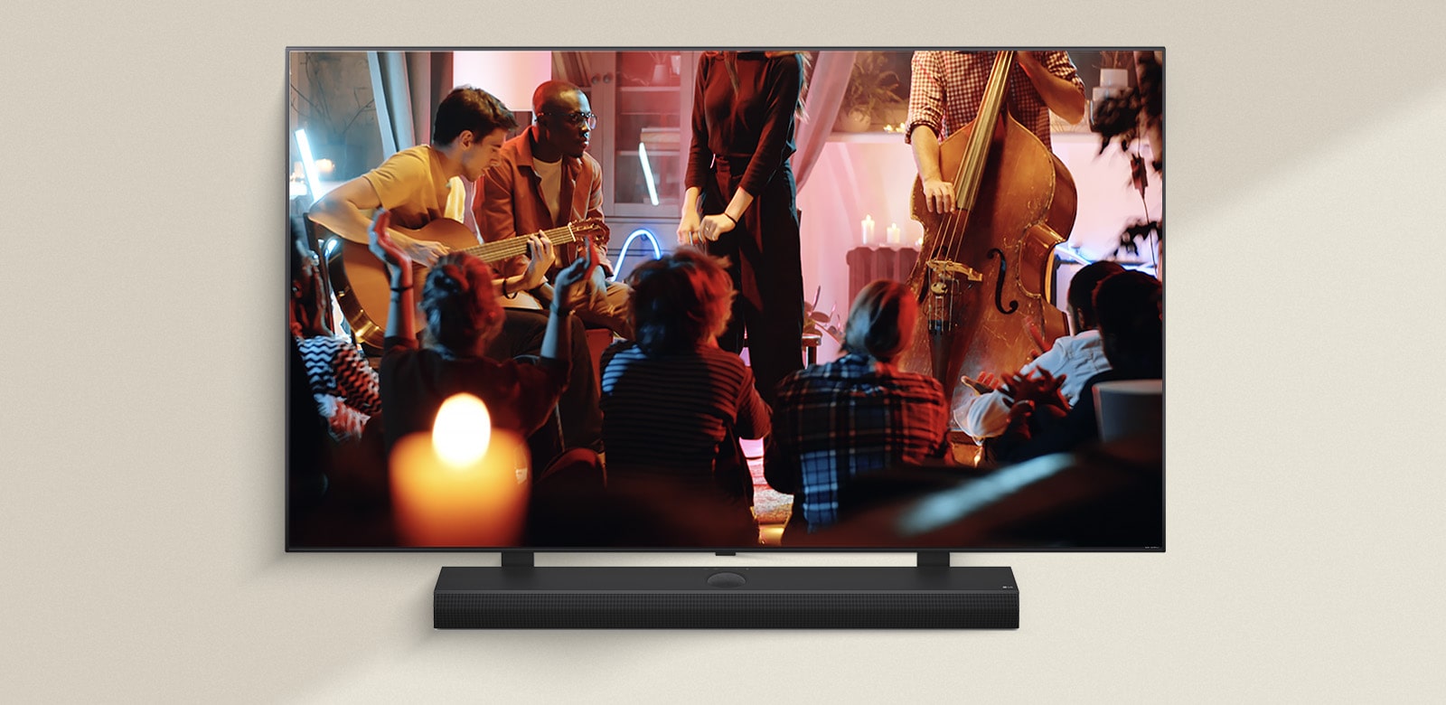 A cozy concert in a living room is playing on the screen. The WOW Interface menu appears as an overlay and the user navigates to soundbar settings.