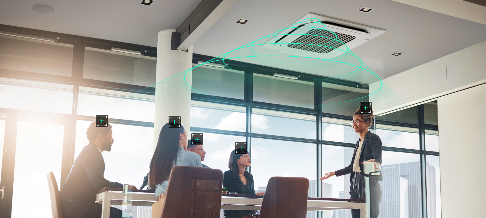 A modern office meeting room with an LG ceiling-mounted cassette uses human detection sensor technology to detect and direct airflow toward individuals.