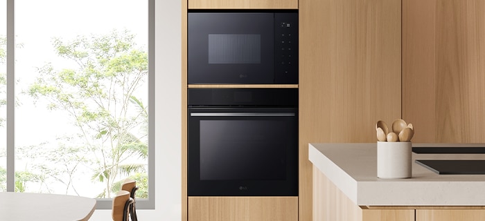 The kitchen with installation of microwave oven.