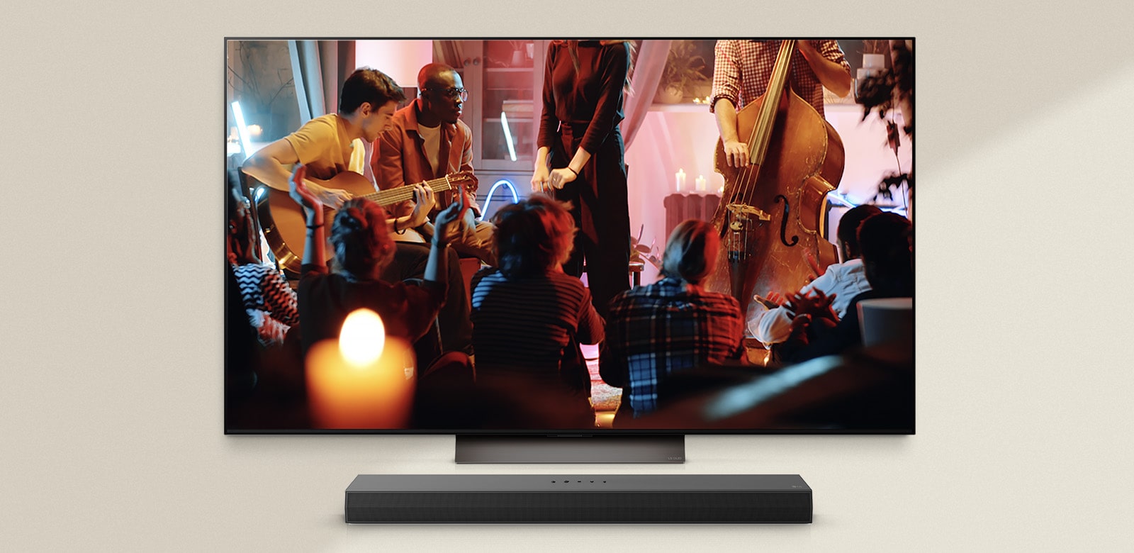 A cozy concert is playing on an LG TV with an LG Soundbar underneath.