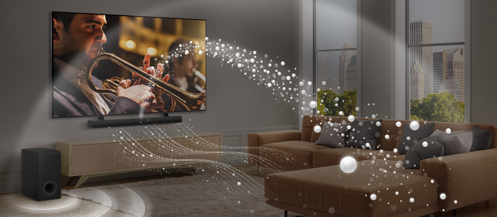 يظهر مكبر LG Soundbar وتلفزيون LG TV ومضخم صوت في شقة حديثة بالمدينة. يُصدر مكبر الصوت LG Soundbar ثلاثة فروع من الموجات الصوتية المصنوعة من قطرات بيضاء تطفو على طول الجزء السفلي من الأرض. تنطلق المزيد من الموجات الصوتية البيضاء من أعلى مكبر الصوت soundbar. بجوار مكبر الصورت Soundbar يوجد مضخم صوت يقوم بإنشاء تأثير صوتي من الأسفل. تُنشيء بشكل عام تأثير القبة في جميع أنحاء الغرفة.