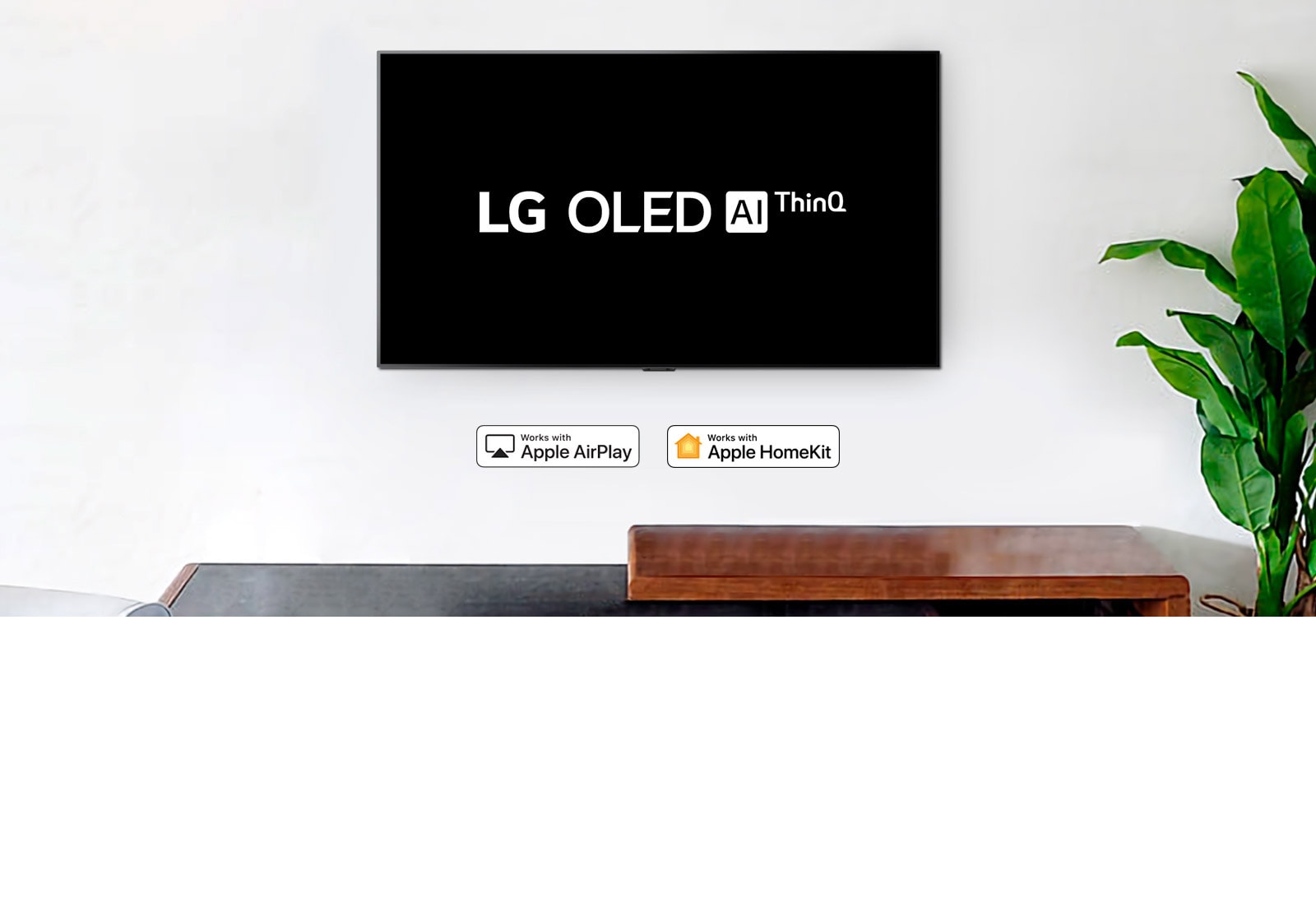 تلفزيون مثبت على الحائط يعرض شعار LG OLED بتقنية AI ThinQ على خلفية سوداء