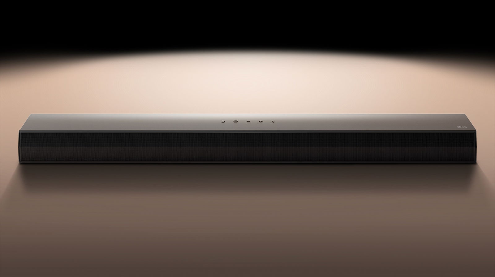 An image of the LG Soundbar against a black backdrop highlighted by a spotlight. 