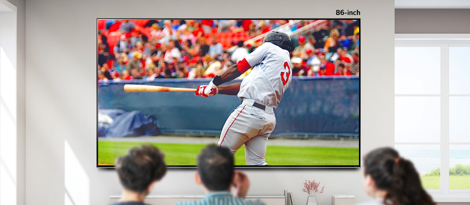 A scrollable image of three people watching baseball on a large wall mounted TV. As you scroll from left to right the screen gets bigger.