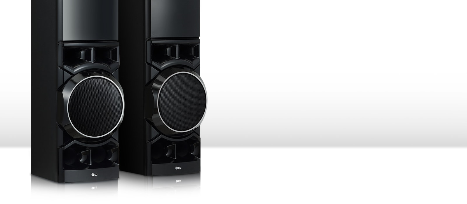 On the white living room, the lower part of the two tower speakers is seen big.