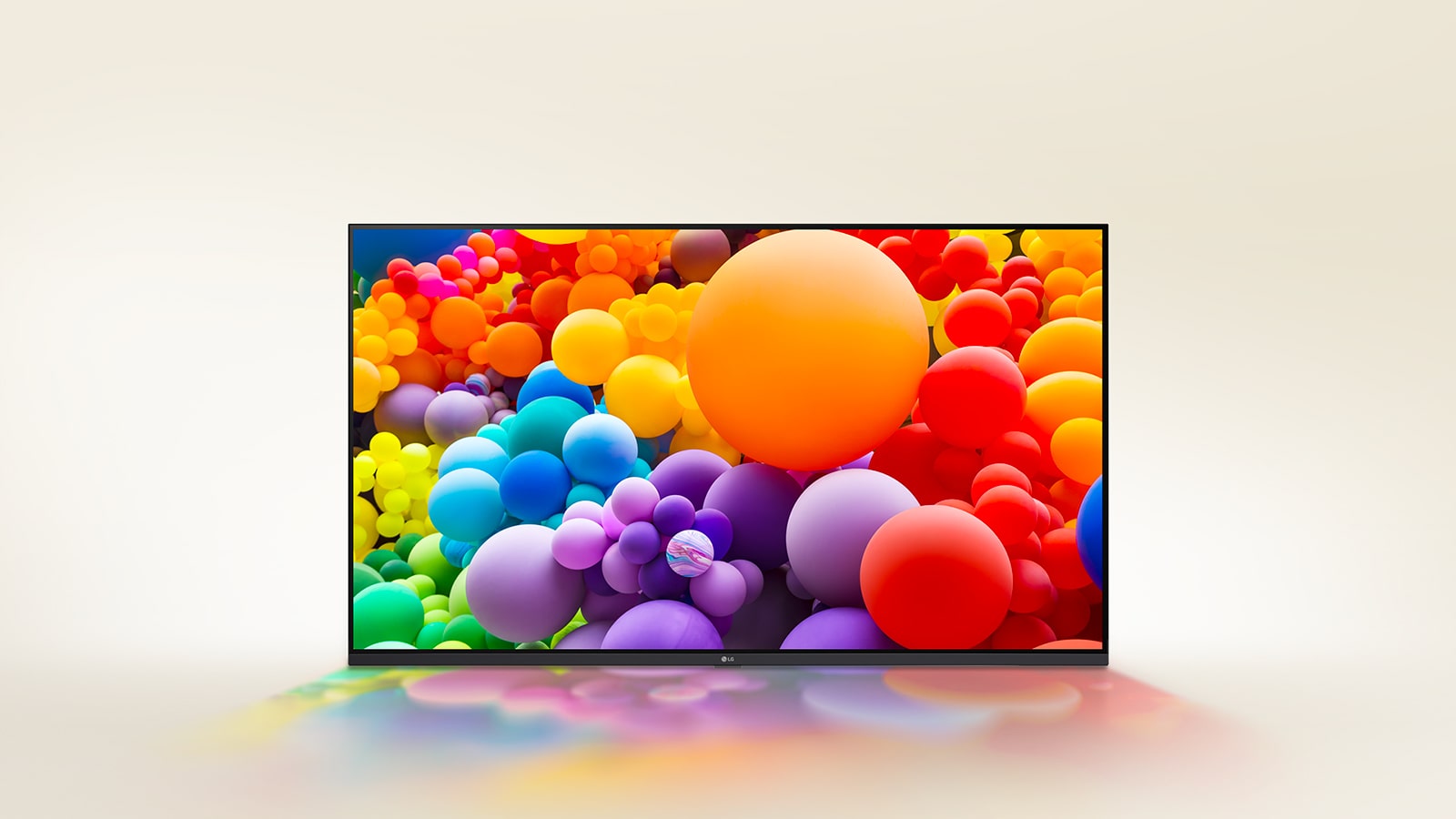 Auf dem LG UHD-Fernseher werden viele Ballons mit unterschiedlichen Farben angezeigt.	