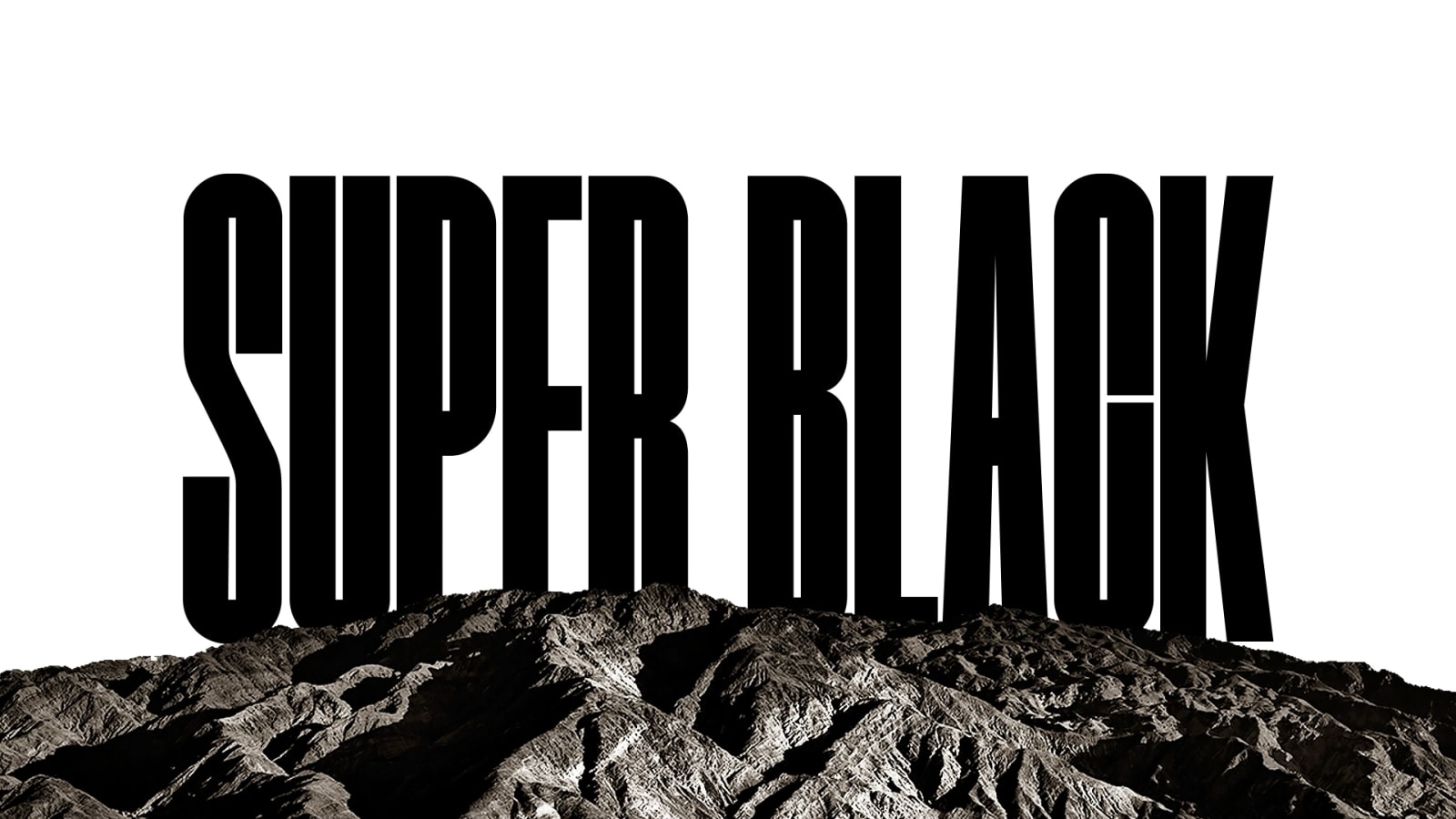 A video opens with the words "SUPER BLACK" in bold black capitals. A black mountainous scene with crisp definition then rises to cover the letters, also revealing a village and sand dunes. The black copy disappears behind a black sky.