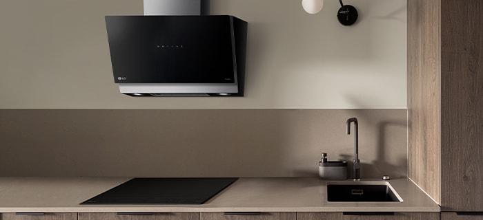 The LG built-in induction cooktop and hood installed in the kitchen.