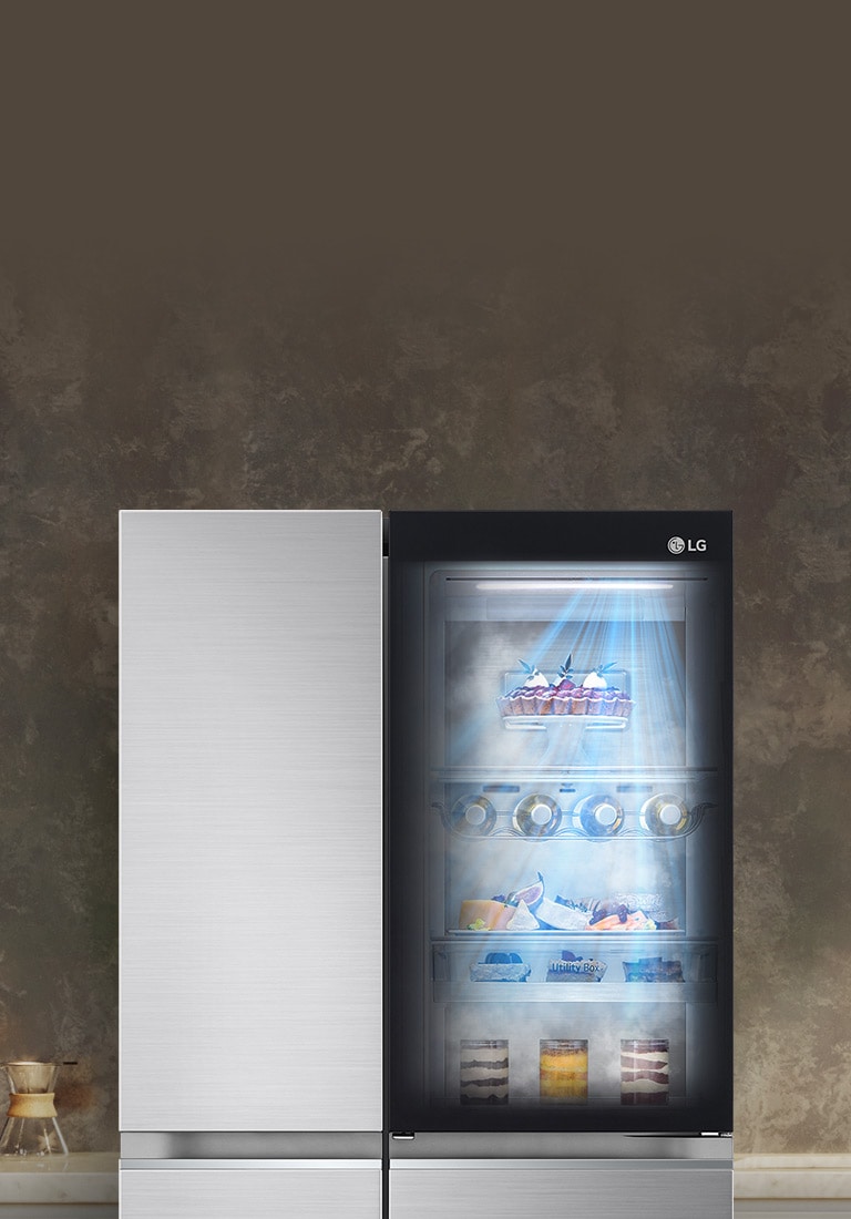 The front view of a black InstaView refrigerator with the light on inside. The contents of the refrigerator can be seen through the InstaView door. Blue rays of light shine down over the contents from the DoorCooling function. 