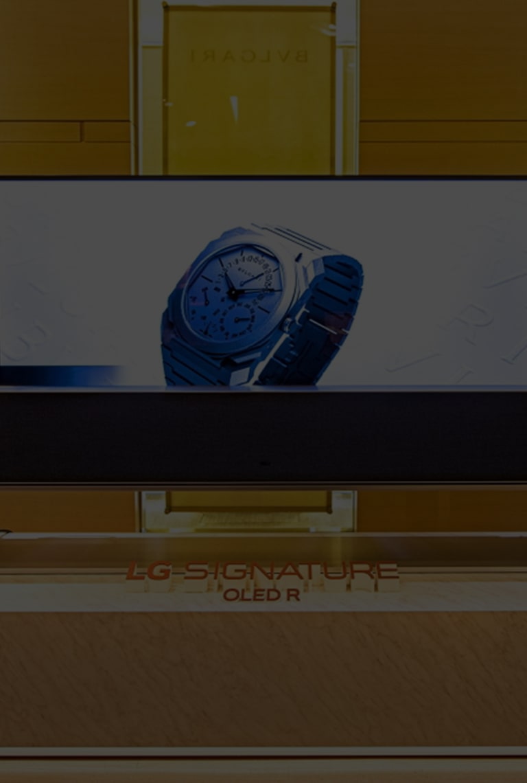 Article title overlaid on an image of a Rollable OLED TV R showing a Bulgari watch onscreen.