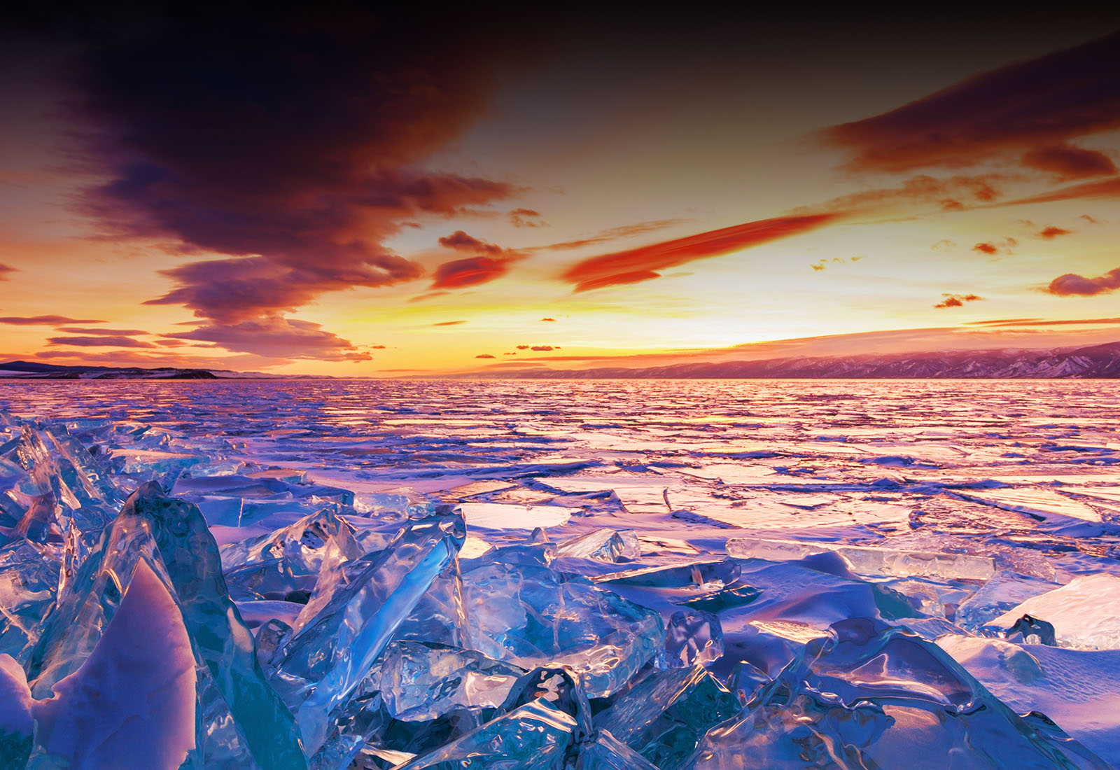 A scenic view of a sunset and glaciers.