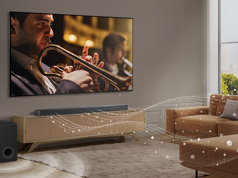 Une LG Soundbar, une LG TV et un caisson de basse sont dans un salon urbain moderne. La LG Soundbar émet trois branches sonores composées de gouttelettes blanches qui flottent sur le sol. À côté de la Soundbar, un caisson de basse crée un effet sonore depuis la base.