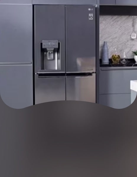 LG American-style fridge freezer in stainless steel built into contemporary kitchen cabinets, showcasing premium finish and integrated water dispenser.