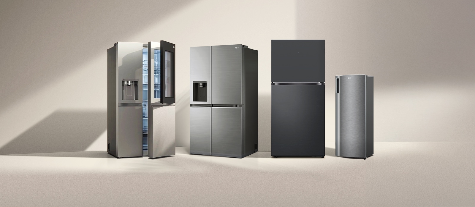 Four LG refrigerator freezers in the sun. Left french door refrigerator with two-door and side-by-side models with one-door next to it.