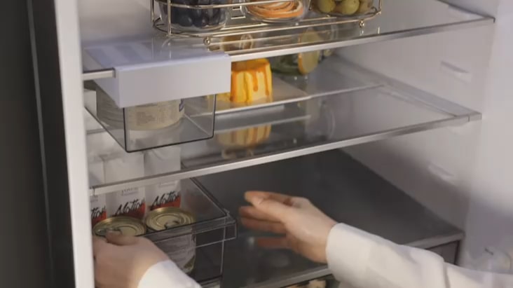 LG Fridge Freezer folding shelf adjusted to store tall items like bottles. LG Fridge Freezer folding shelf adjusted to store tall items like bottles.