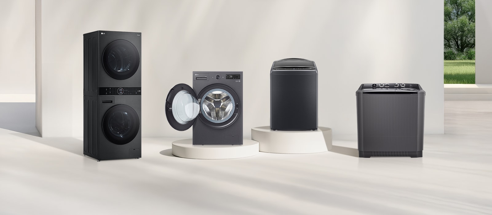 Lineup of LG WashTower™, Front Load, Top Load, and Twin Tub washing machines in a bright modern Saudi laundry space.