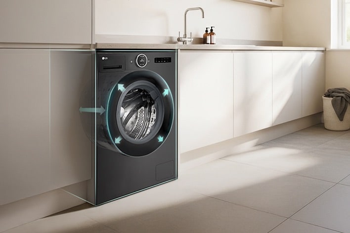Black LG washing machine control panel close-up. The display shows "Detecting Load Level," with a power button on the left and a hand pressing the right-side button