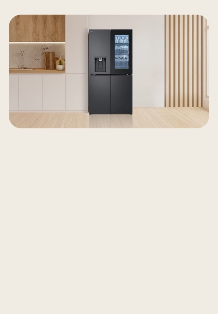 Black LG Multi-Door fridge freezer with InstaView Door-in-Door placed in a beige-toned kitchen. The fridge has a spacious design with visible storage sections.
