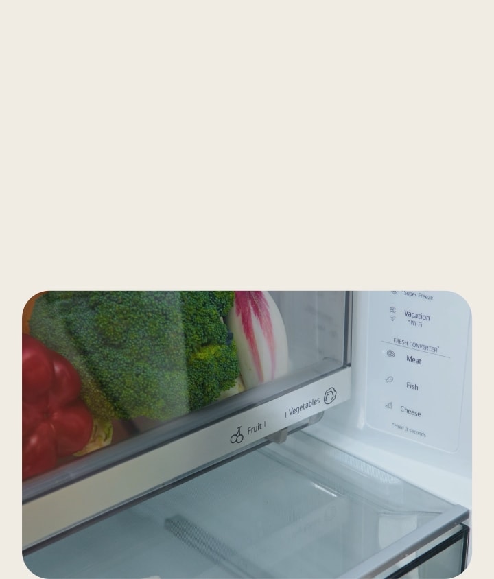 A user sliding LG Fit & Max Fridge Freezer FRESHBalancer option from Vegetables to Fruit to adjust humidity for produce.