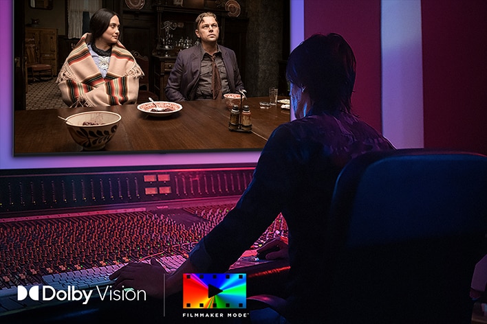 LG QNED evo AI QNED85 Mini LED is shown in a studio as a director works at a control panel while editing a movie displayed on screen. The Dolby Vision and FILMMAKER MODE logos appear at the bottom left.