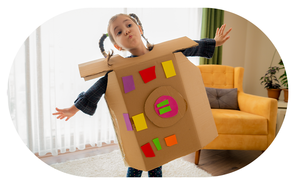 little girl in cardboard spaceship suit