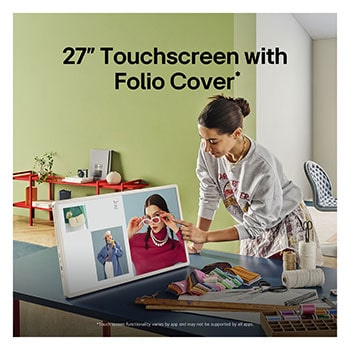 A person rolling their LG StanbyME 2 using the TV stand. The text explains how the Super Portable Screen has 4 hours of wireless playback and USB-C.