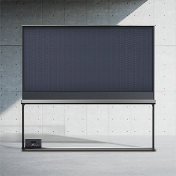 Rear view of LG SIGNATURE OLED T with the shade drawn up to show the black backdrop and the back of a Zero Connect Box.