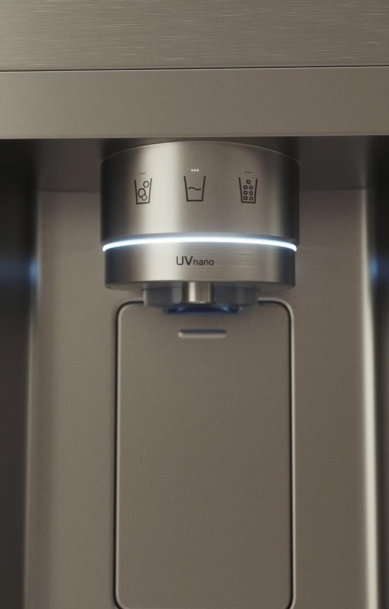 The image shows a water dispenser in the door of a stainless steel fridge.