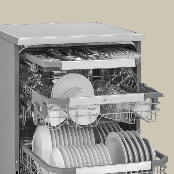 Showcasing how spatulas, spoons, forks, and knives are arranged in the 3rd rack of an LG free-standing dishwasher.