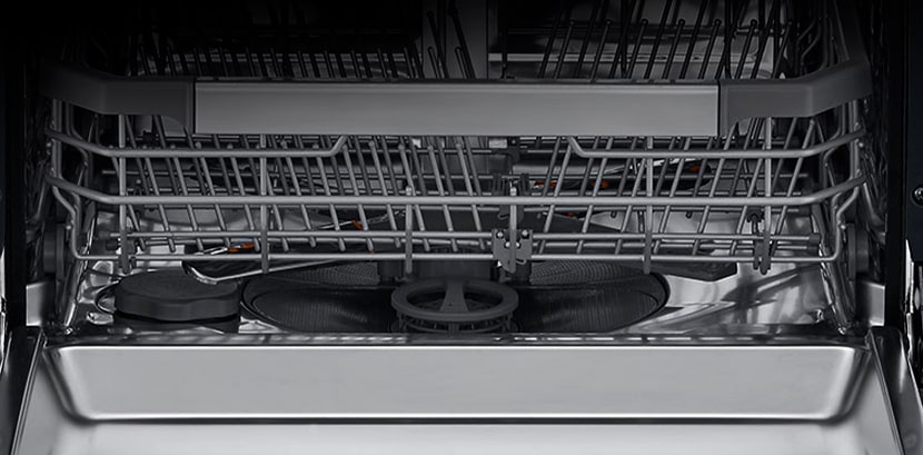 The stainless steel interior of the dishwasher.