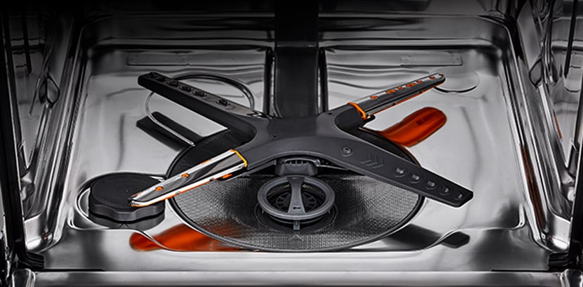 The stainless steel interior of the dishwasher.