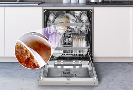 A freestanding dishwasher with the door fully open, revealing dirty dishes inside.