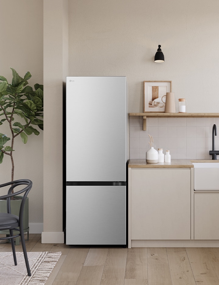 Overall view of the kitchen with lg bottom freezer refrigerator installed beside the countertop.	