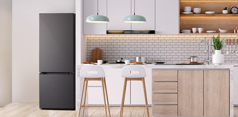 The overall view of  lg bottom freezer refrigerator in a kitchen.	