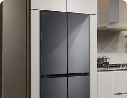 Modern kitchen interior with stainless fridge.