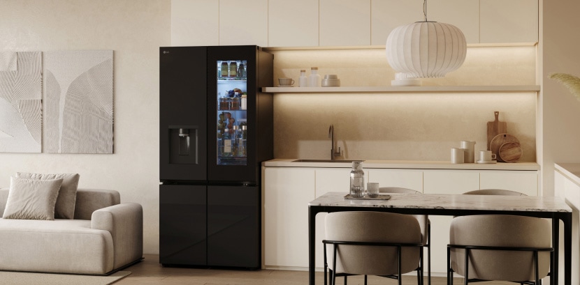 A cozy living room and kitchen are reflected in the sleek design of the lg french door refrigerator with mirror doors.