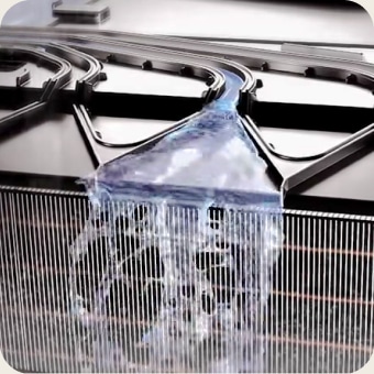 Image with clean water running over a condenser.