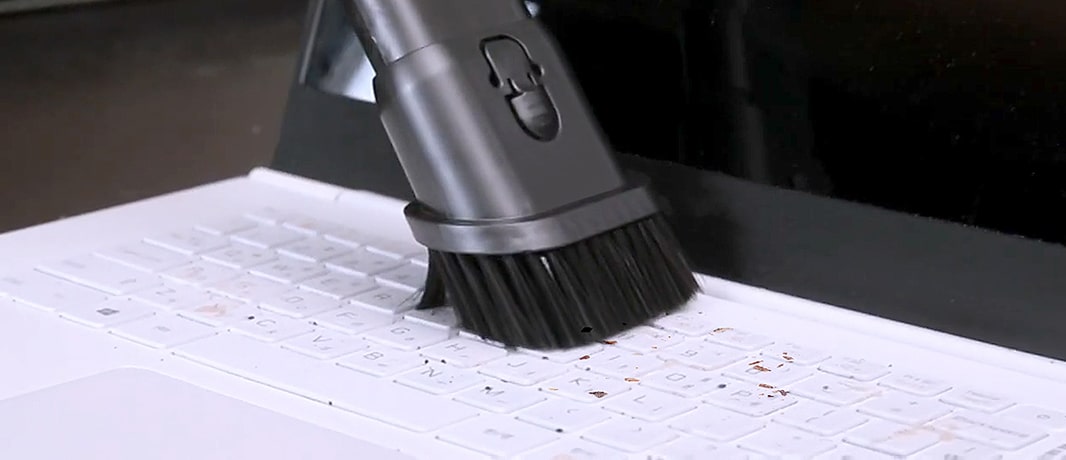 Image of using the Combination Tool to remove dust from a laptop	