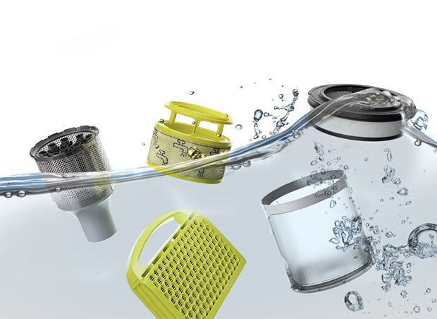 Image shows various components of the vacuum, including filters and dust bin immersed in water.	