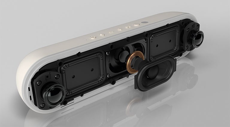 The LG StanbyME speaker XT7S is placed on the reflective surface, showing its dual tweeters.