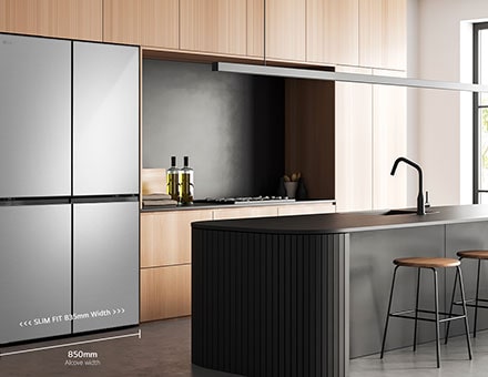 Modern kitchen interior with stainless fridge.