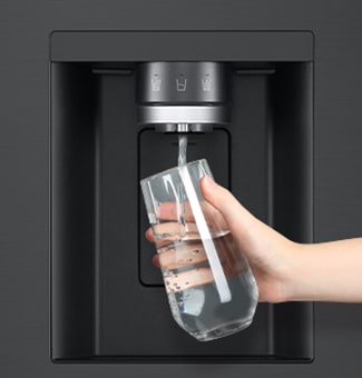  A person is getting water from the refrigerator dispenser in a cup