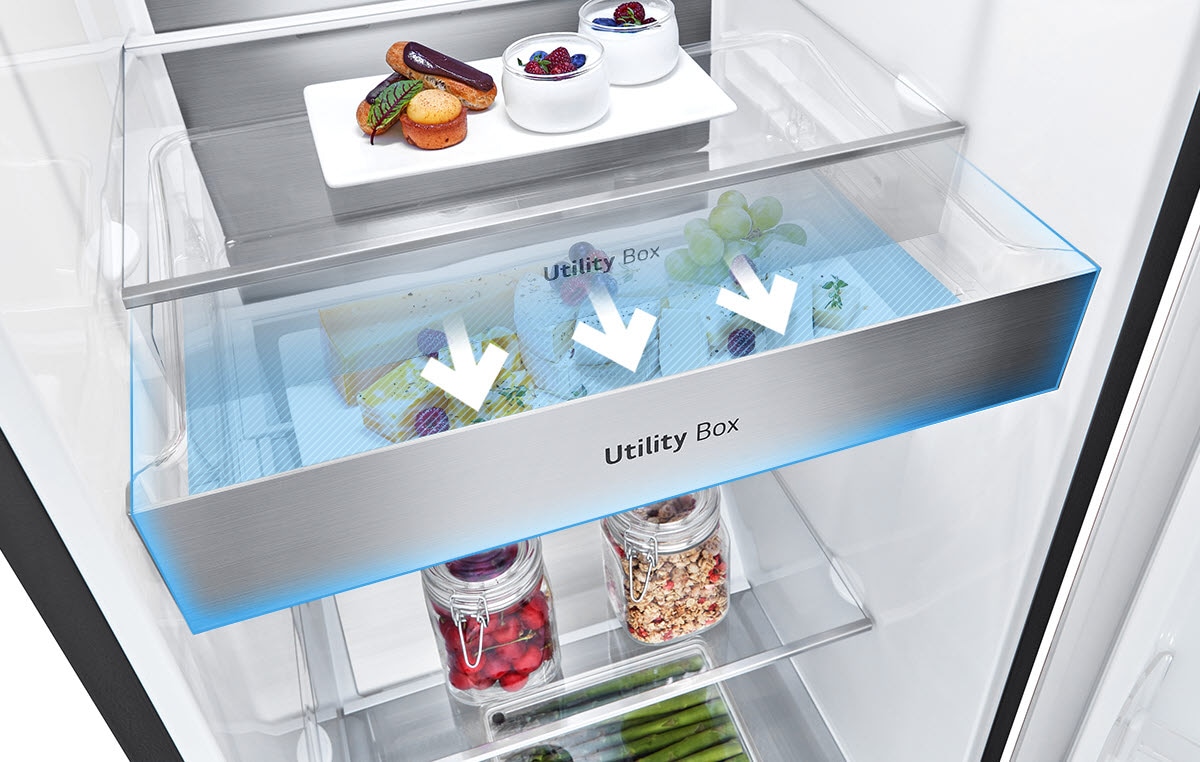 Open fridge showcasing a utility box with three arrows pointing at fresh food items, desserts, and jars of produce.