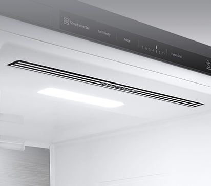 The top interior of the fridge is shown with the soft LED light bright.