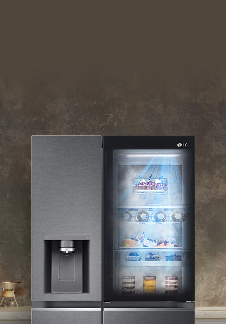 The front view of a black InstaView refrigerator with the light on inside. The contents of the refrigerator can be seen through the InstaView door. Blue rays of light shine down over the contents from the SurroundCooling function.